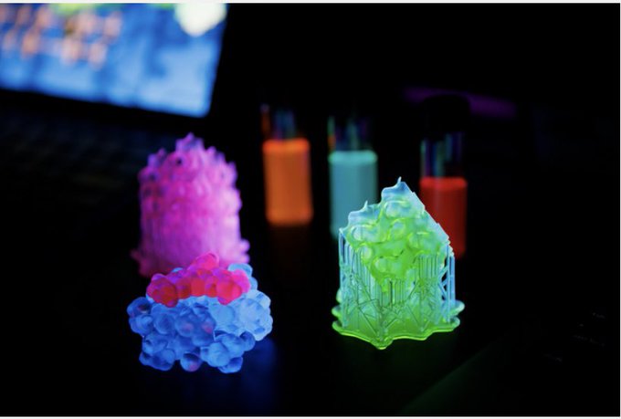 3D printed SMILES materials containing fluorescent dyes emit a luminescent glow under ultraviolet light.